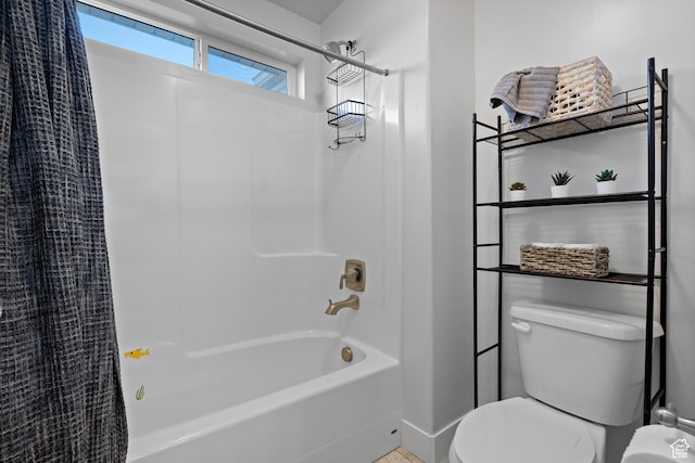 bathroom with toilet and shower / bathtub combination with curtain