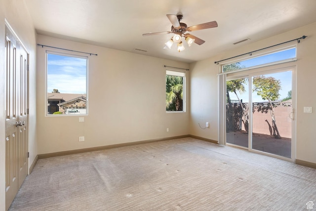3523 S Desert Hills Dr, St George, UT 84790 - spare room featuring light colored carpet, baseboards, a ceiling fan, and visible vents