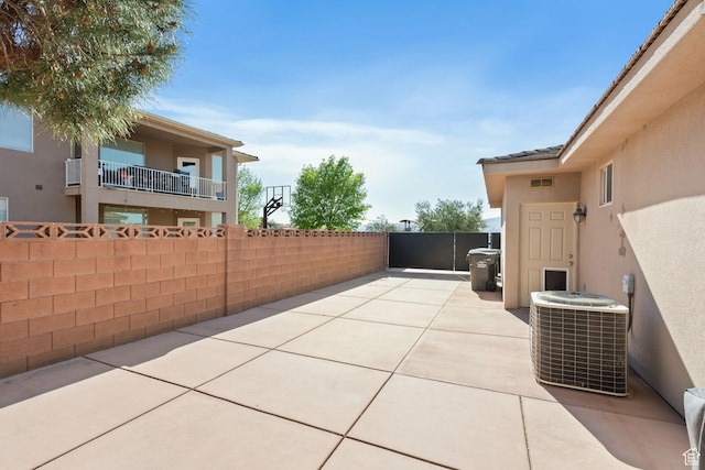 3523 S Desert Hills Dr, St George, UT 84790 - view of patio with a gate, fence, visible vents, and central AC