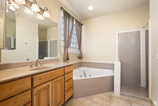 3523 S Desert Hills Dr, St George, UT 84790 - full bathroom featuring tile patterned flooring, vanity, a bath, and a stall shower
