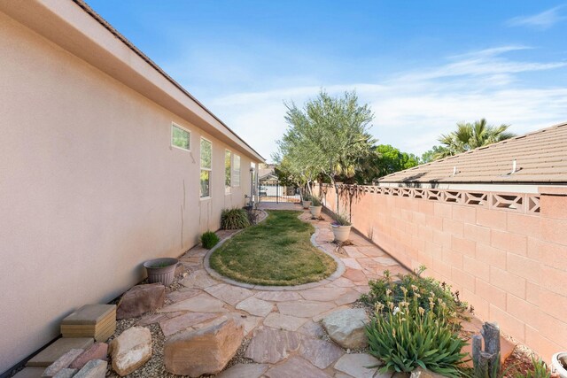 3523 S Desert Hills Dr, St George, UT 84790 - view of yard with a fenced backyard and a patio