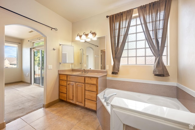 3523 S Desert Hills Dr, St George, UT 84790 - full bathroom with tile patterned flooring, baseboards, vanity, and a garden tub