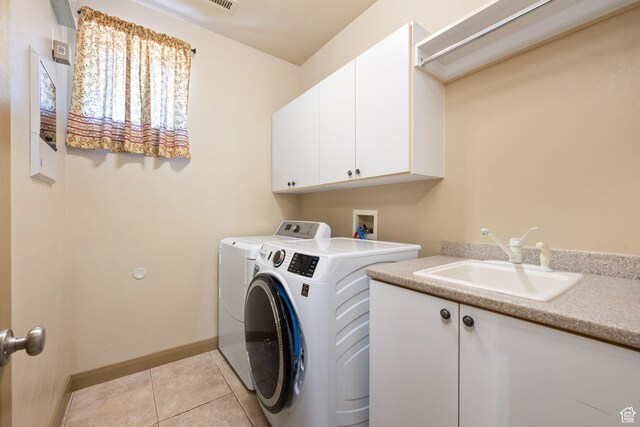 3523 S Desert Hills Dr, St George, UT 84790 - laundry room featuring light tile patterned floors, baseboards, a sink, independent washer and dryer, and cabinet space