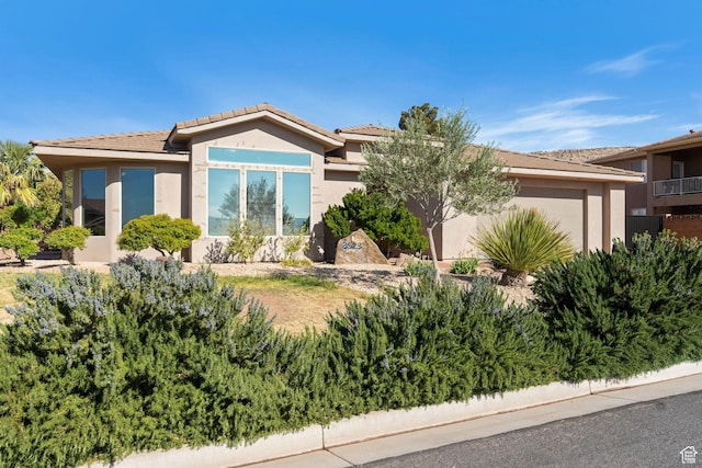 3523 S Desert Hills Dr, St George, UT 84790 - view of front of home with a garage and stucco siding