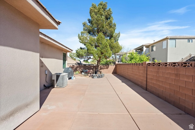 3523 S Desert Hills Dr, St George, UT 84790 - view of patio featuring a fenced backyard and cooling unit