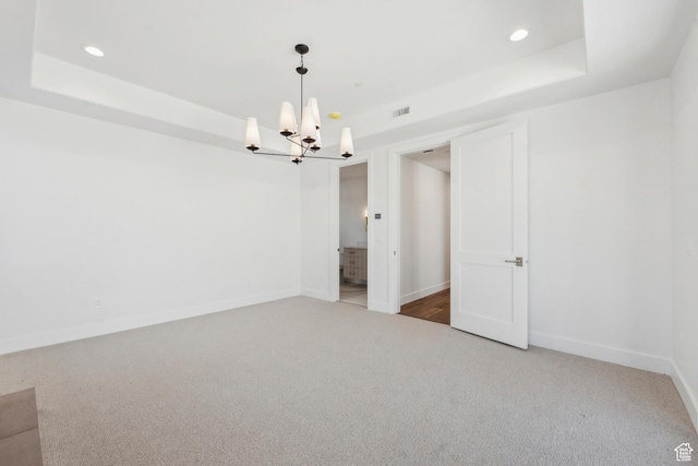 2738 Longspur Ln, Park City, UT 84098 - unfurnished room featuring a tray ceiling, a chandelier, and carpet floors