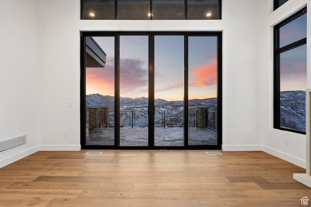 2738 Longspur Ln, Park City, UT 84098 - spare room with a mountain view and light wood-type flooring