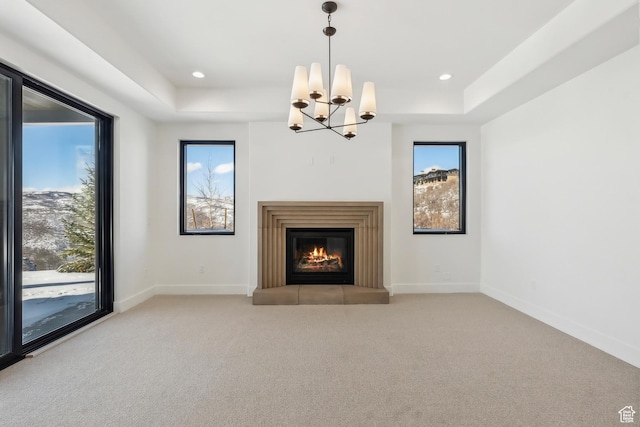 2738 Longspur Ln, Park City, UT 84098 - unfurnished living room featuring a chandelier, a raised ceiling, and light carpet