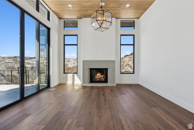 2738 Longspur Ln, Park City, UT 84098 - unfurnished living room with wood ceiling, hardwood / wood-style flooring, and a chandelier