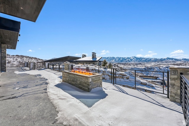 2738 Longspur Ln, Park City, UT 84098 - snow covered patio with a mountain view and a fire pit