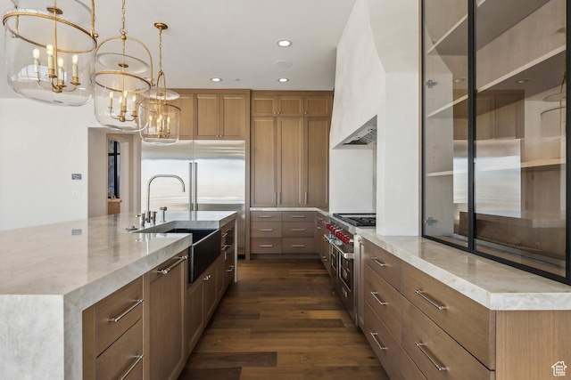 2738 Longspur Ln, Park City, UT 84098 - kitchen with sink, hanging light fixtures, a large island with sink, dark hardwood / wood-style flooring, and a notable chandelier