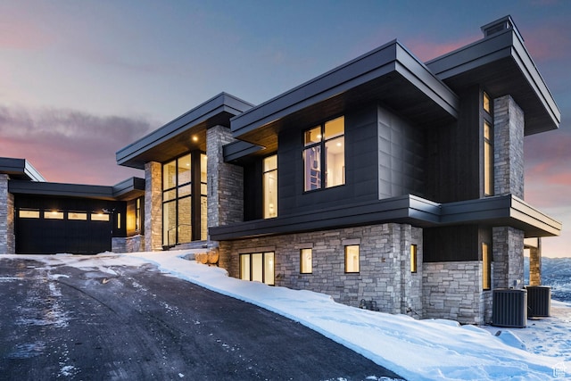 2738 Longspur Ln, Park City, UT 84098 - view of front facade featuring a garage and cooling unit