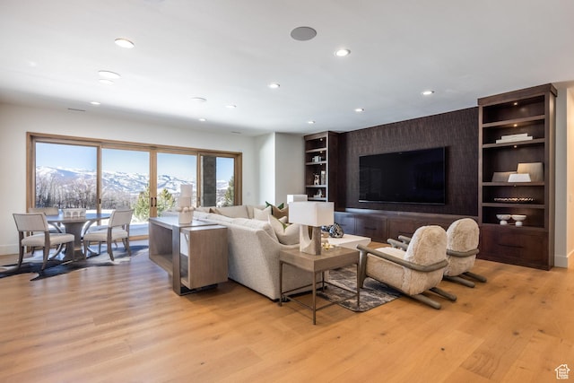 9791 N Uinta Dr, Kamas, UT 84036 - living area with built in features, baseboards, recessed lighting, and light wood finished floors