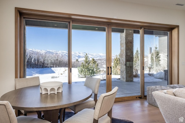 9791 N Uinta Dr, Kamas, UT 84036 - dining space with a mountain view, visible vents, french doors, and wood finished floors