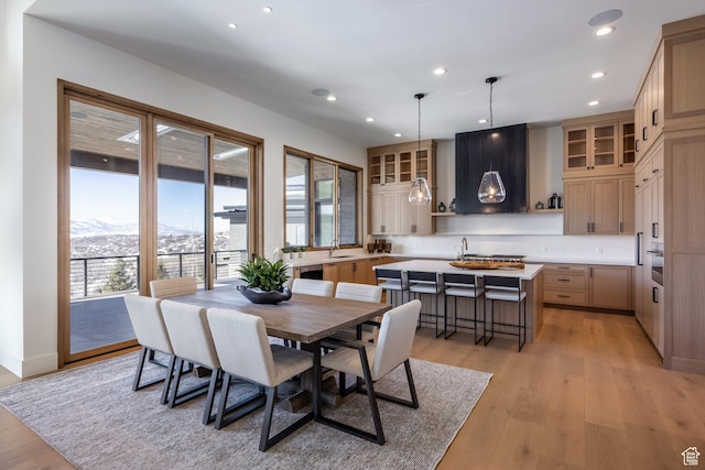 9791 N Uinta Dr, Kamas, UT 84036 - dining area featuring a mountain view, a wealth of natural light, light wood-style floors, and recessed lighting