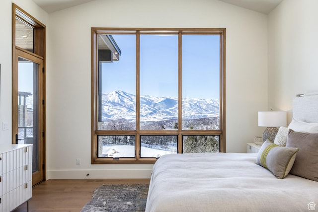 9791 N Uinta Dr, Kamas, UT 84036 - bedroom with baseboards, a mountain view, wood finished floors, and vaulted ceiling