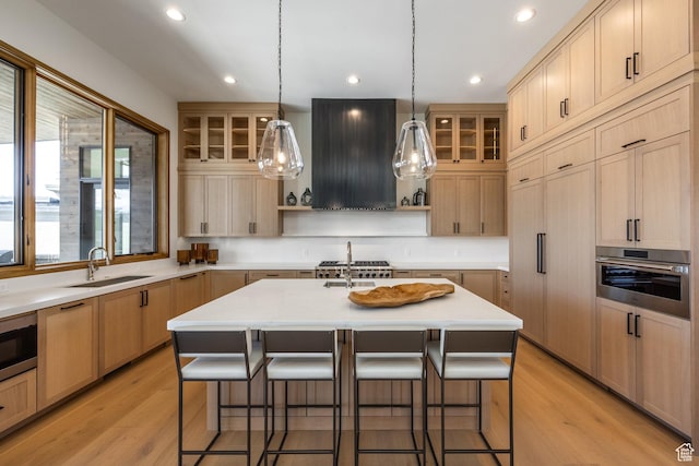 9791 N Uinta Dr, Kamas, UT 84036 - kitchen with a breakfast bar area, ventilation hood, appliances with stainless steel finishes, and open shelves
