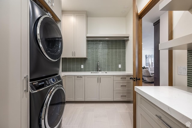 9791 N Uinta Dr, Kamas, UT 84036 - washroom with cabinet space, stacked washer / dryer, and a sink
