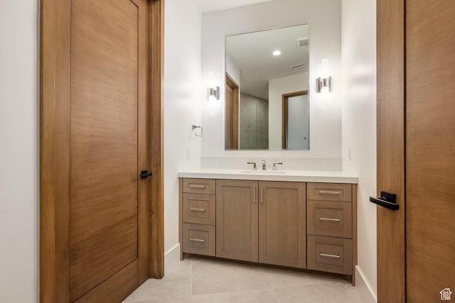 9791 N Uinta Dr, Kamas, UT 84036 - bathroom with tile patterned floors, vanity, baseboards, and visible vents