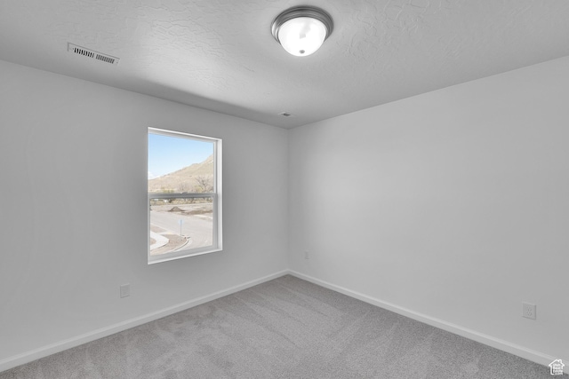 1946 E Burger St Unit 1237, Lake Point, UT 84074 - carpeted empty room featuring baseboards and a textured ceiling