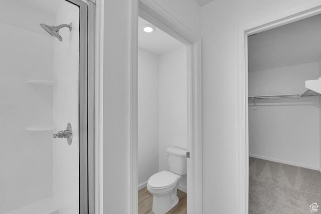 1946 E Burger St Unit 1237, Lake Point, UT 84074 - full bath featuring a stall shower, toilet, a spacious closet, and baseboards