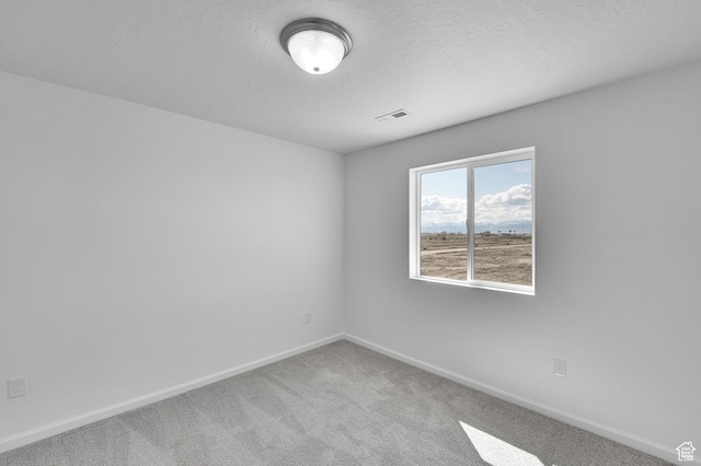 1946 E Burger St Unit 1237, Lake Point, UT 84074 - carpeted spare room with baseboards and a textured ceiling