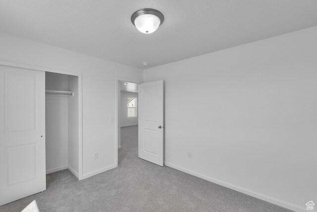 1946 E Burger St Unit 1237, Lake Point, UT 84074 - unfurnished bedroom with carpet floors, baseboards, and a closet