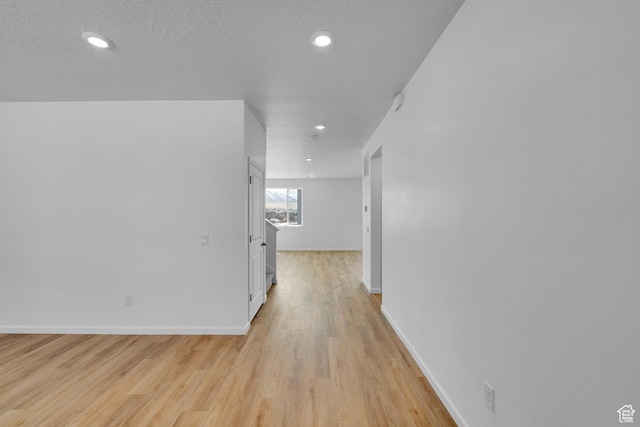 1946 E Burger St Unit 1237, Lake Point, UT 84074 - corridor featuring baseboards, light wood-style flooring, and recessed lighting