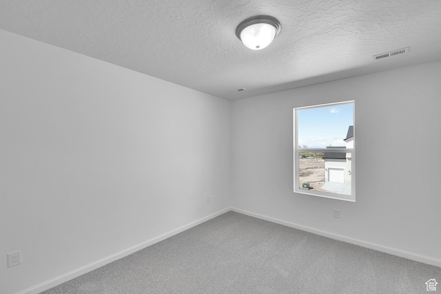1946 E Burger St Unit 1237, Lake Point, UT 84074 - carpeted spare room featuring a textured ceiling and baseboards