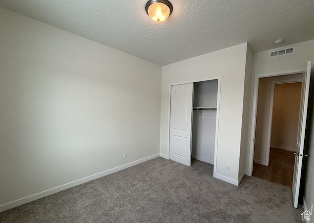283 E Polaris Dr Unit 102, Saratoga Springs, UT 84045 - unfurnished bedroom featuring visible vents, baseboards, carpet, and a closet