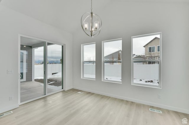 283 E Polaris Dr Unit 102, Saratoga Springs, UT 84045 - spare room with an inviting chandelier, wood finished floors, and visible vents
