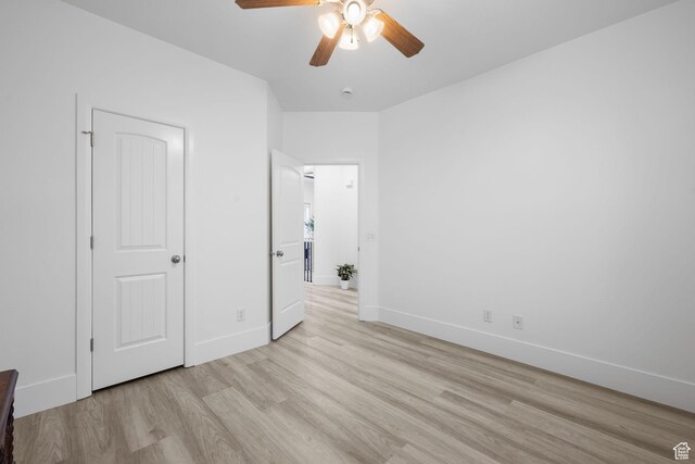 unfurnished bedroom with light hardwood / wood-style flooring and ceiling fan