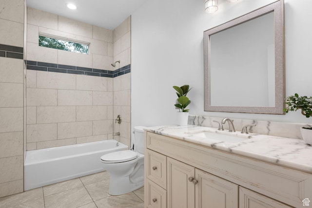 full bathroom with tile patterned floors, vanity, toilet, and tiled shower / bath