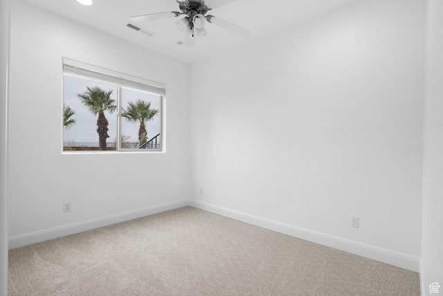unfurnished room featuring ceiling fan and carpet floors