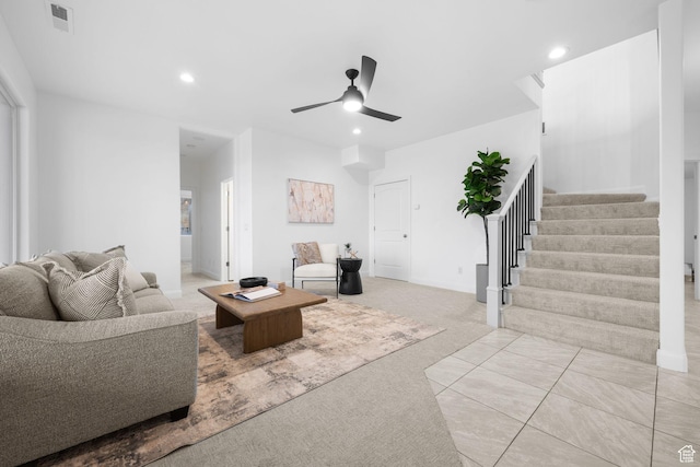 carpeted living room featuring ceiling fan