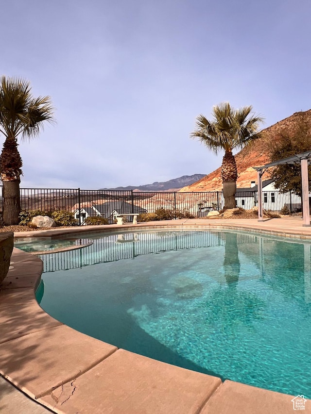 view of swimming pool featuring a mountain view