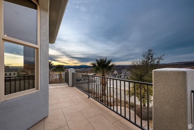 view of balcony at dusk
