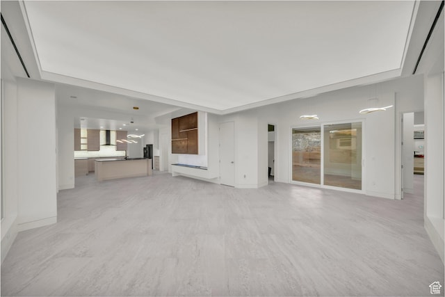 unfurnished living room featuring light wood-type flooring