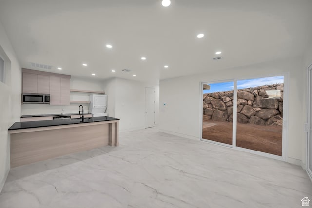 kitchen with sink and light brown cabinets