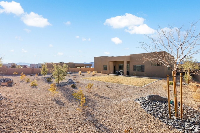 rear view of property featuring a patio