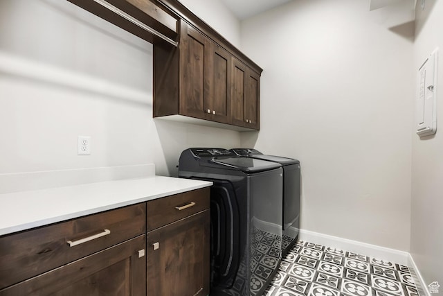 washroom with separate washer and dryer, cabinets, and light tile patterned flooring