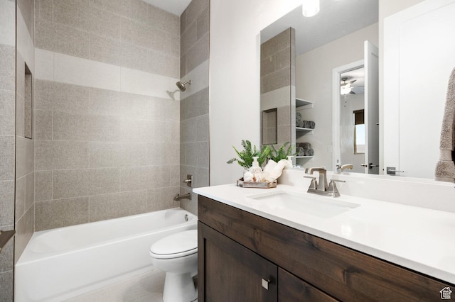 full bathroom with vanity, toilet, and tiled shower / bath combo