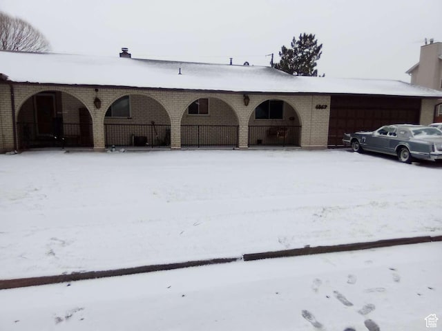 view of snow covered garage