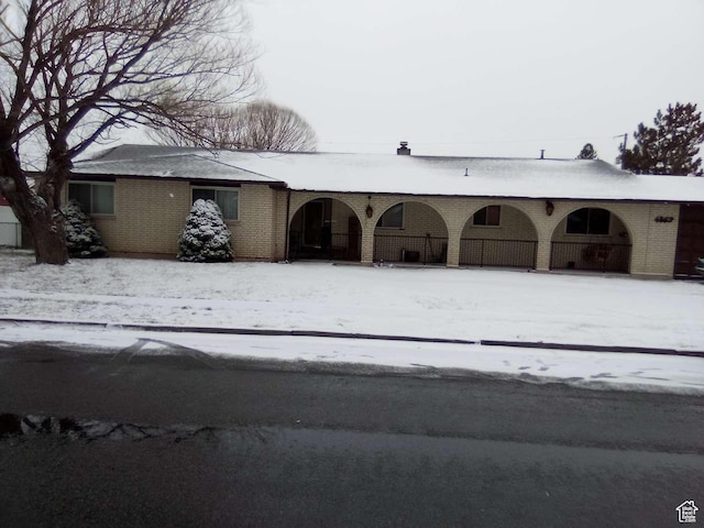 view of snow covered garage