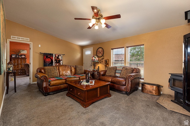 1361 S Roadrunner Cir, Kanab, UT 84741 - carpeted living room featuring lofted ceiling, a wood stove, and ceiling fan