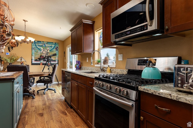 1361 S Roadrunner Cir, Kanab, UT 84741 - kitchen with pendant lighting, light stone countertops, stainless steel appliances, and sink