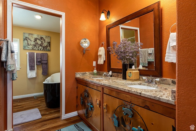 1361 S Roadrunner Cir, Kanab, UT 84741 - bathroom featuring wood-type flooring, a bathtub, and vanity