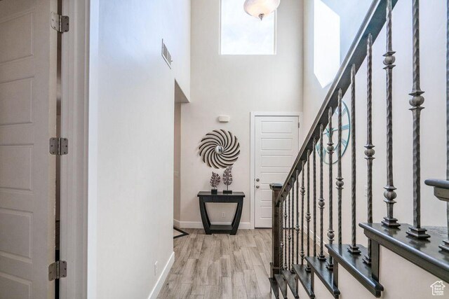 1676 E Escapes Dr, St George, UT 84770 - foyer entrance featuring a towering ceiling and light hardwood / wood-style floors