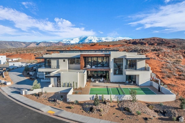 63 E Colima Rd, Washington, UT 84780 - view of front facade featuring a balcony, stucco siding, and a mountain view