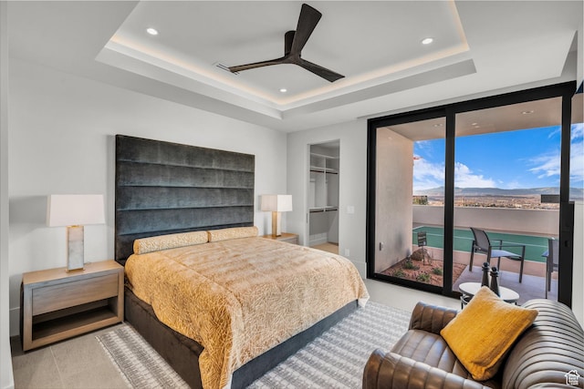 63 E Colima Rd, Washington, UT 84780 - bedroom featuring a tray ceiling, access to exterior, a spacious closet, recessed lighting, and a ceiling fan